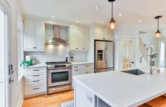 white wooden kitchen cabinet and white kitchen counter